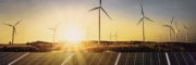 solar panels with wind turbine and sunset .concept power energy in nature